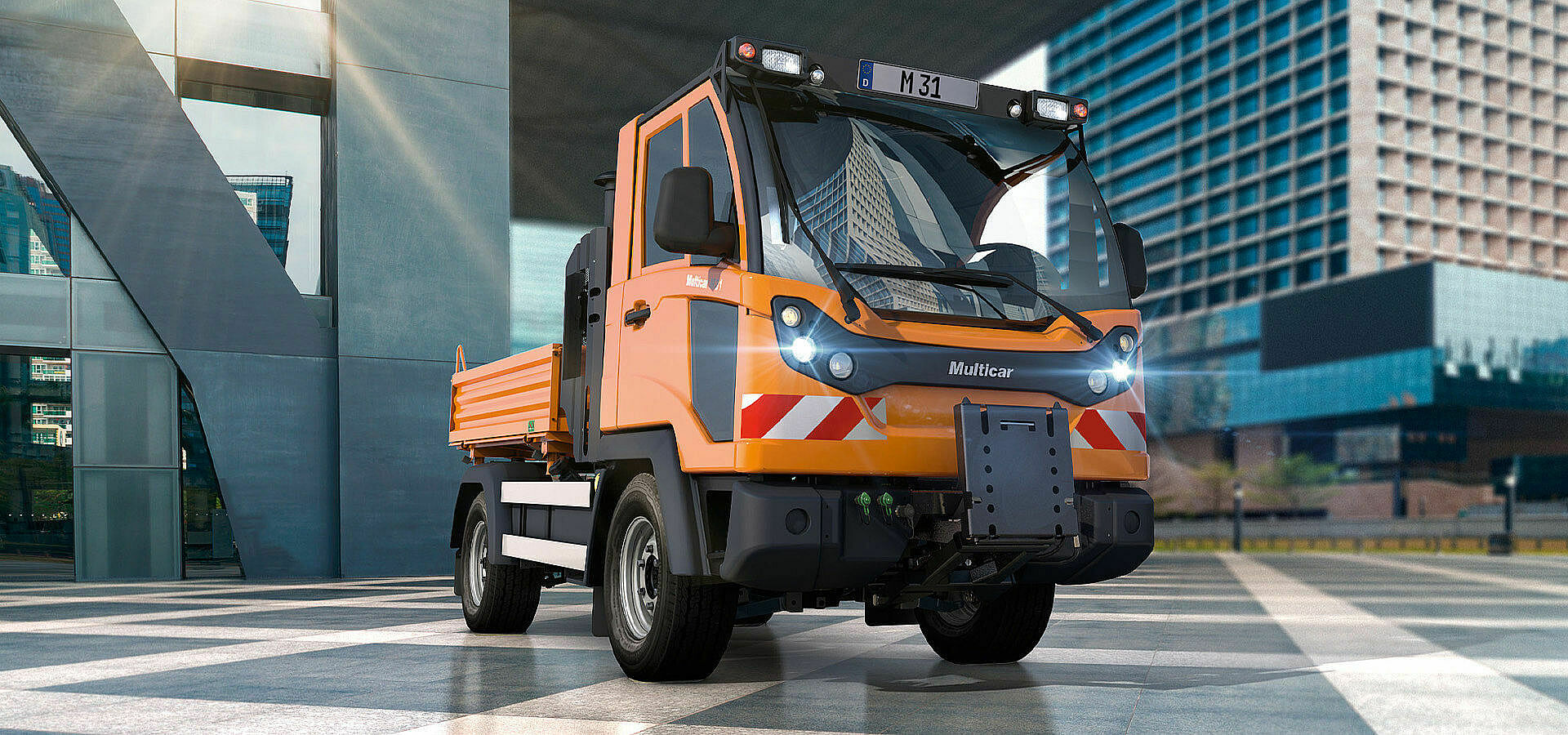 Kommunalfahrzeug und Transporter beim Einsatz im öffentlichen Raum.